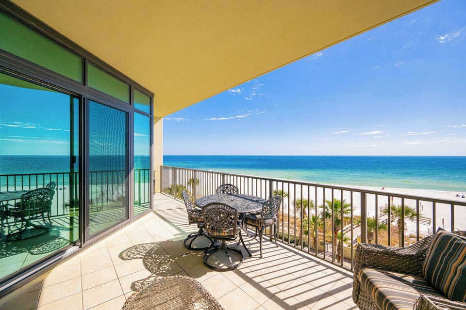 Savor the coastal views from your balcony while relaxing at the outdoor dining table with loved ones
