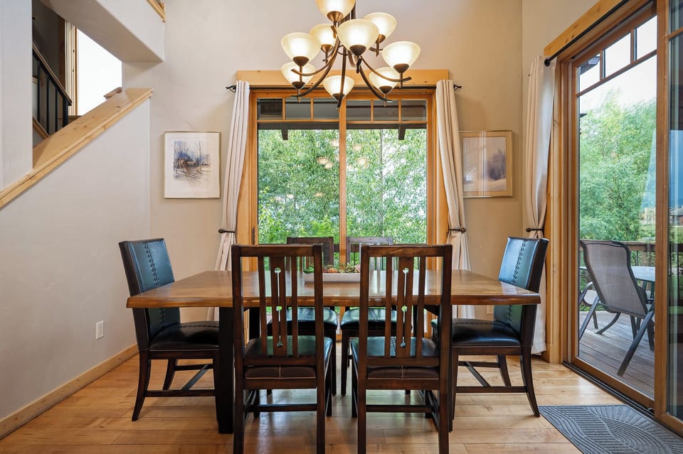 Dining room table with room for six and patio access