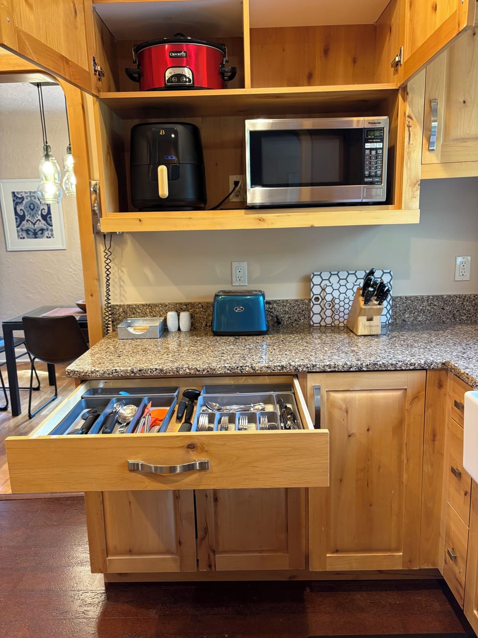 Slow cooker, air-fryer, microwave, toaster - well organized kitchen drawers.