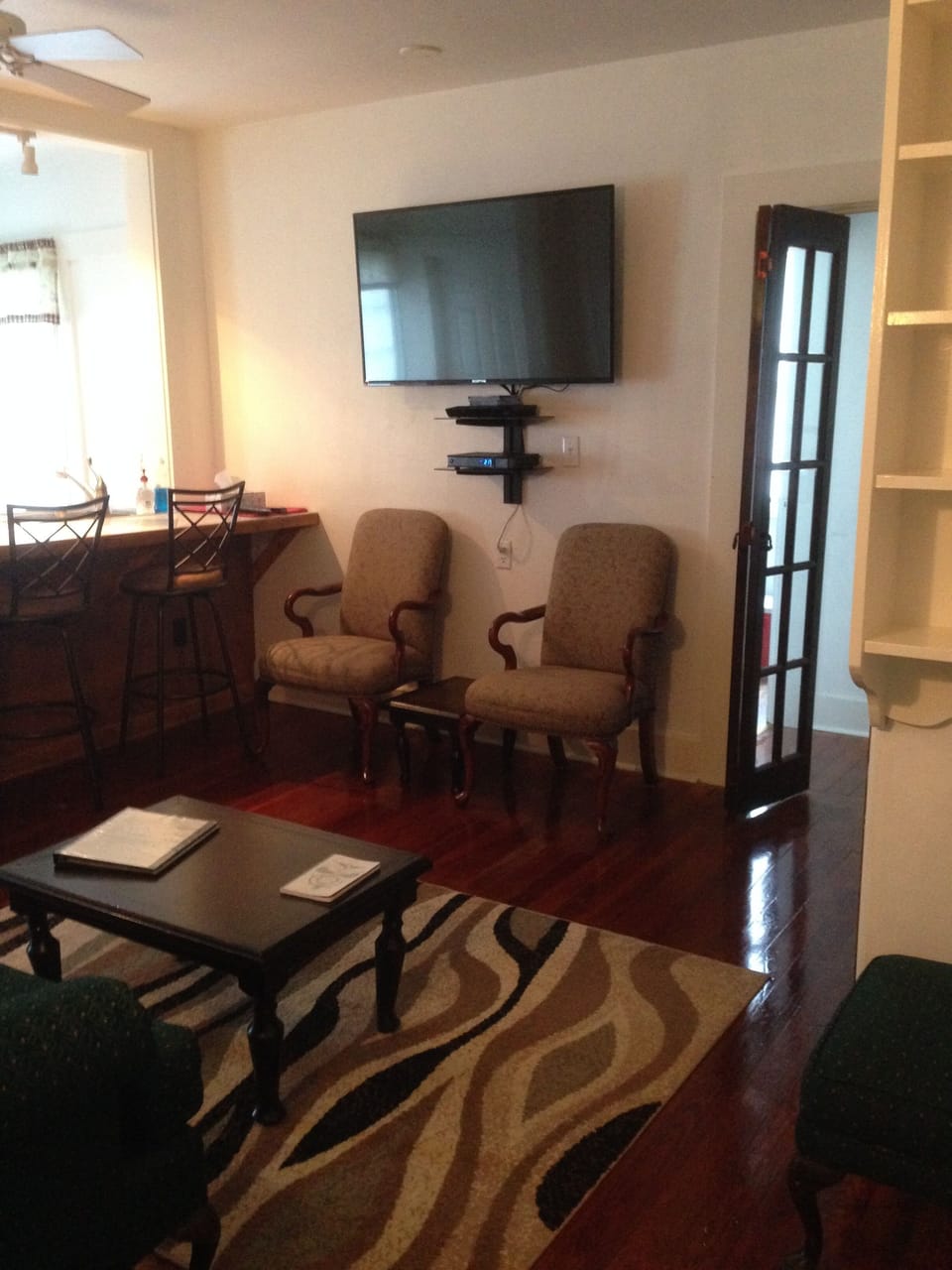 Comfy chairs and Bar Stools Open door leads to laundry room