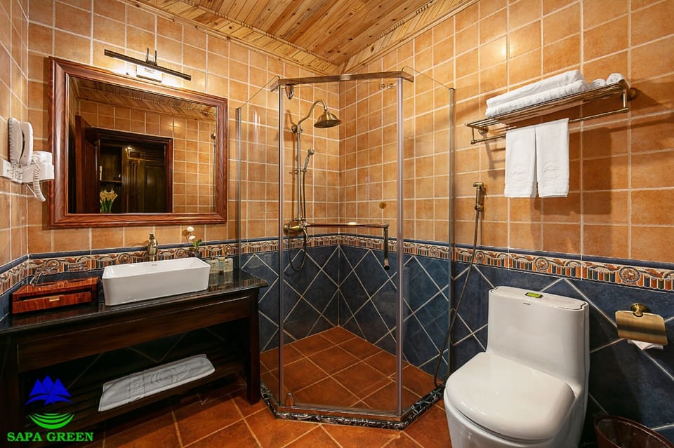 Shower, rainfall showerhead, designer toiletries, hair dryer