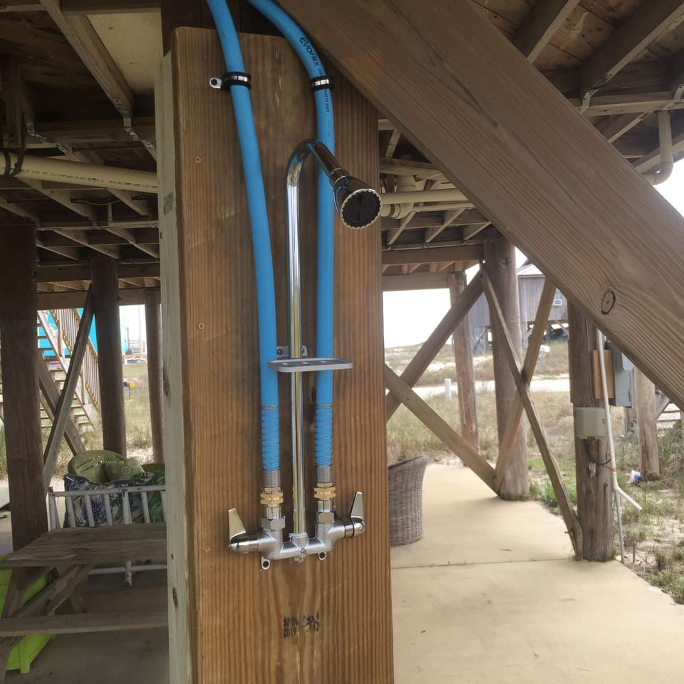 outdoor shower with hot and cold fresh water