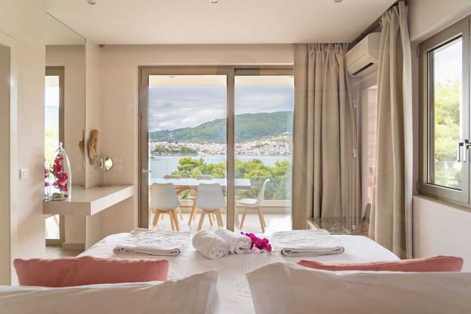 Deluxe Family Suite With Sea View | Living area | Flat-screen TV, printers