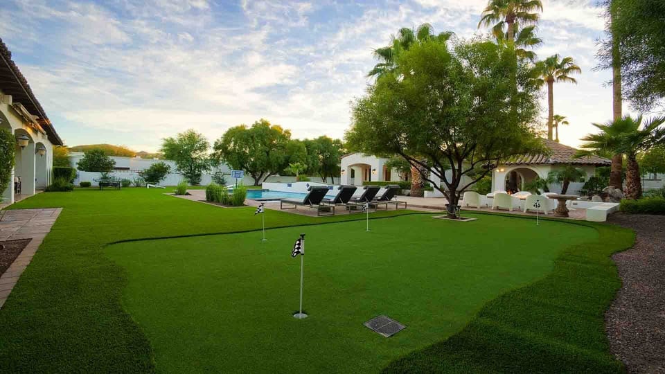 Resort style backyard w/ putting green, pool, volleyball, & more