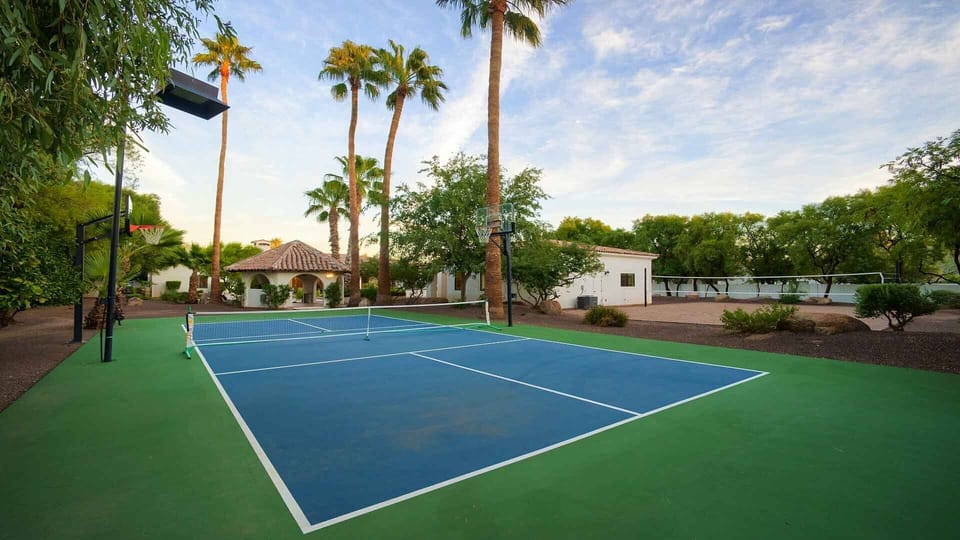 Beautiful sports court for basketball & pickleball surrounded by greenery