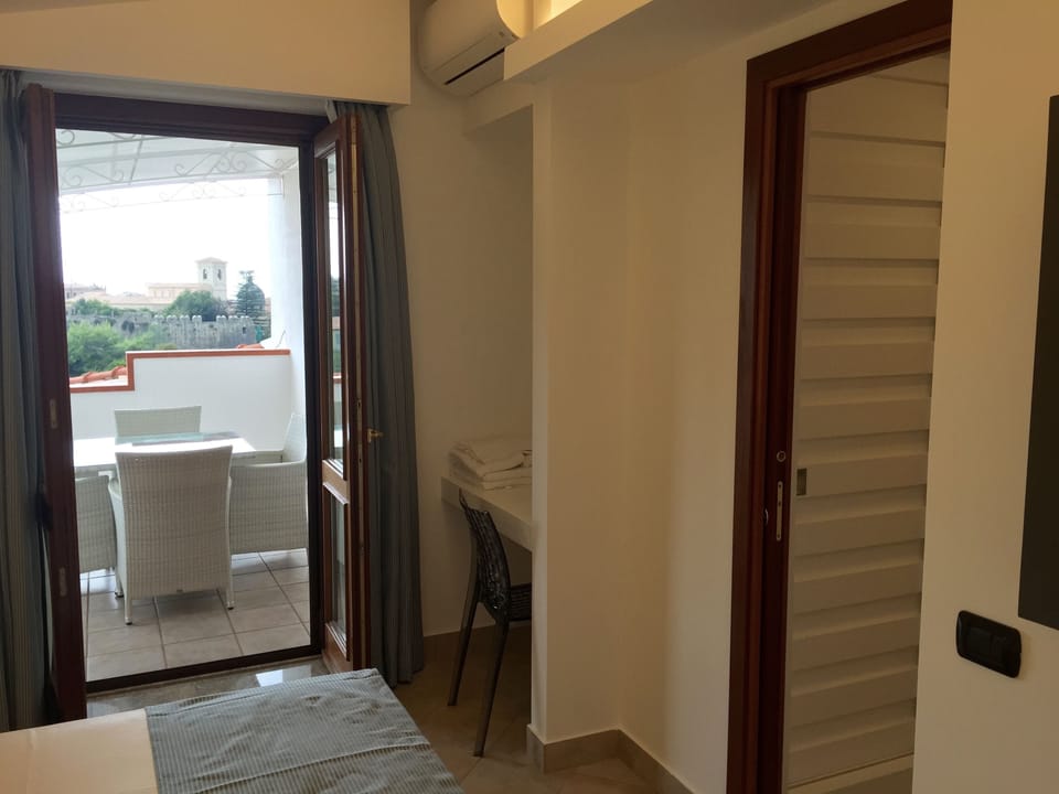 Family Quadruple Room | Premium bedding, minibar, in-room safe, desk