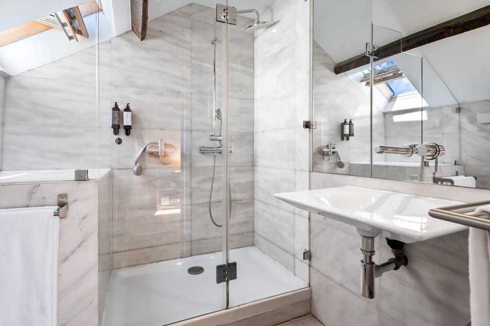 Signature Suite with Terrace and River View | Bathroom | Shower, rainfall showerhead, hair dryer, towels