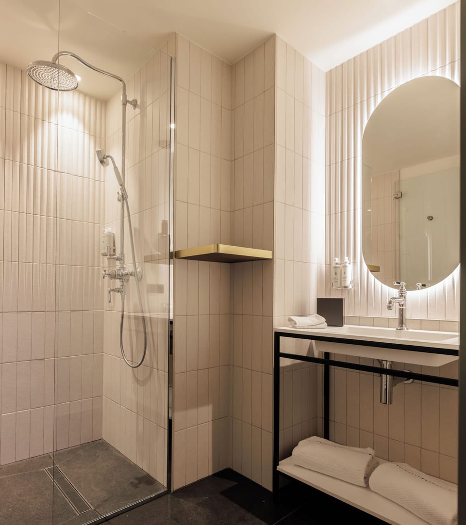 Combined shower/tub, free toiletries, hair dryer, bathrobes