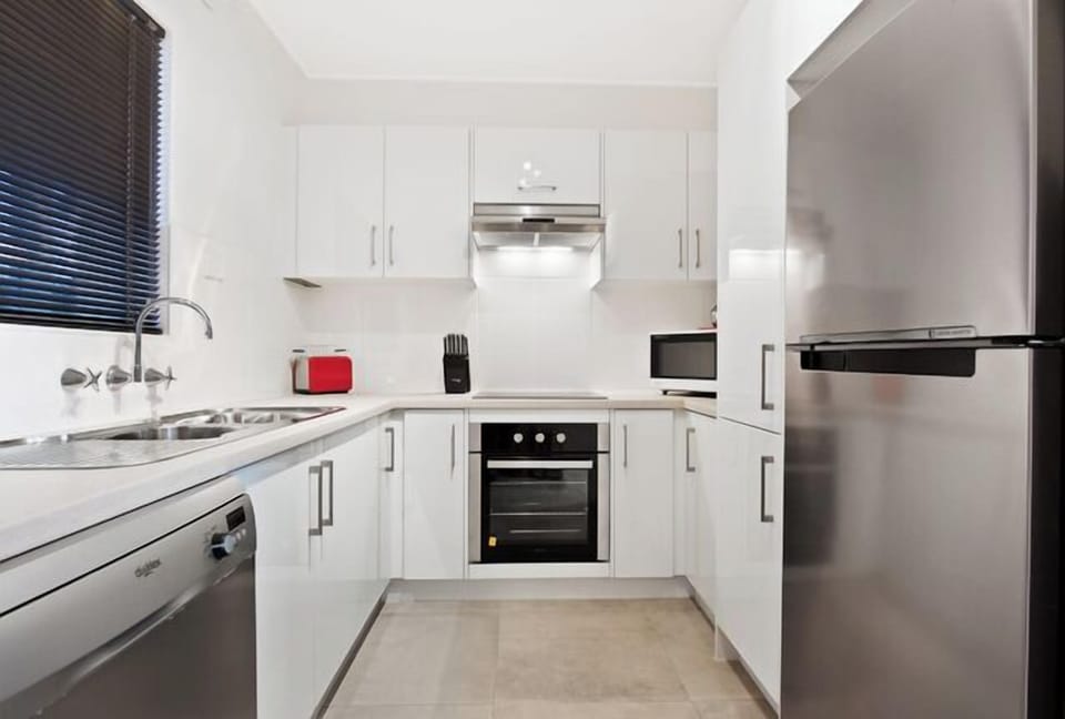 Full kitchen with dishwasher oven and all you need.