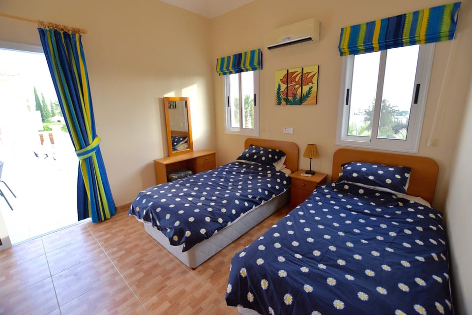 Twin bedroom leading to first floor balcony