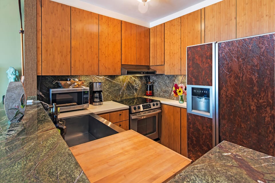 Full sized glass top range and refrigerator with filtered water and ice