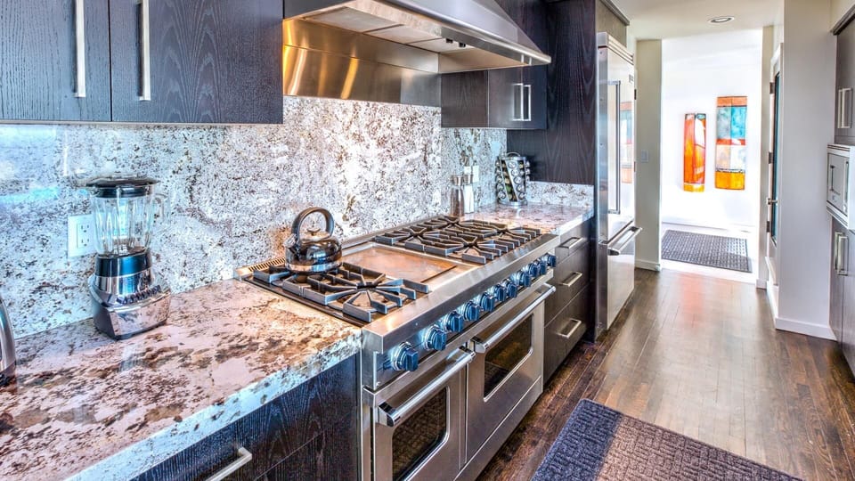 Modern kitchen w/ chefs' range, blender, kettle, & toaster & more