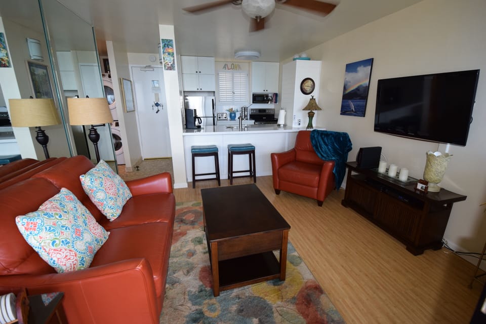 Living Room looking into kitchen and breakfast bar.