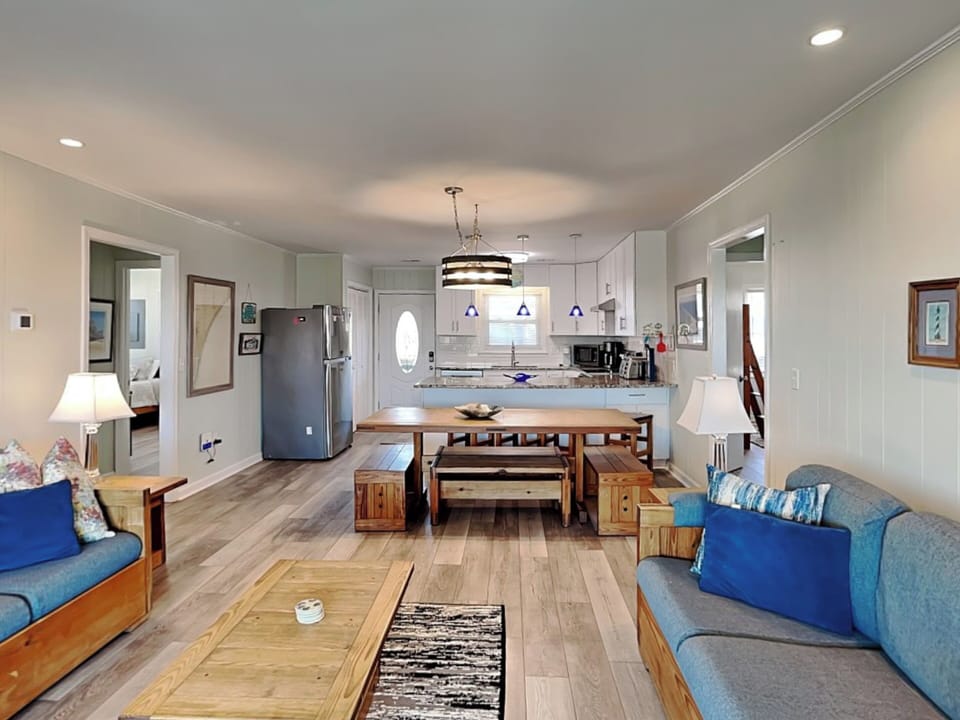 Open-Concept Living Room with Dining and Kitchen Access