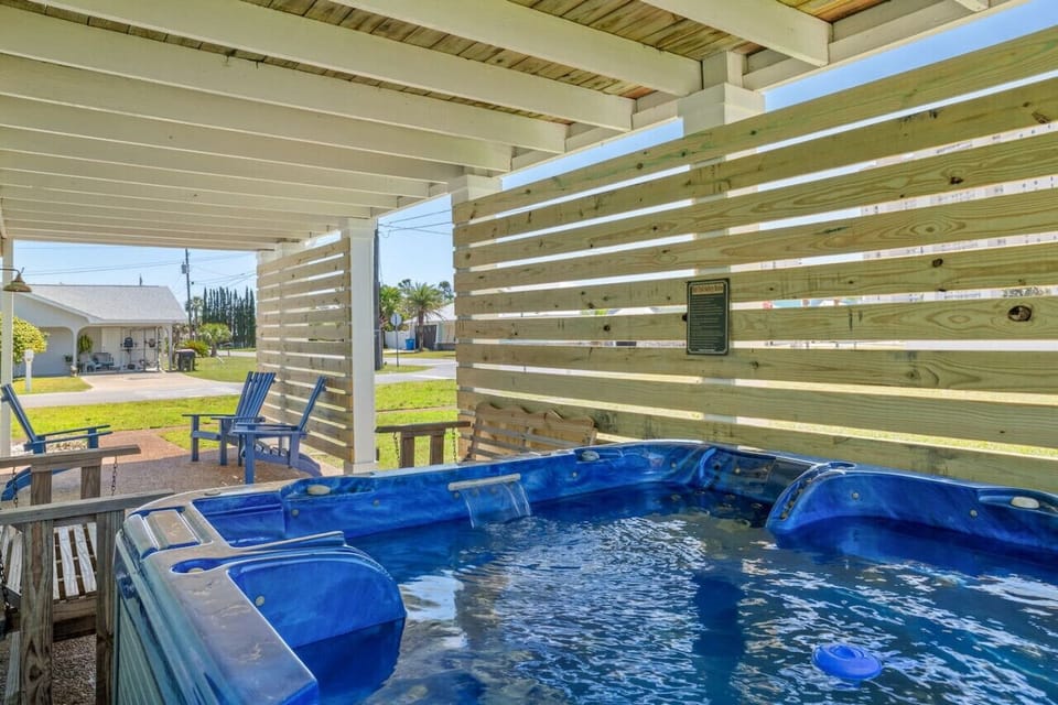 Indulge in seasonal relaxation in our private hot tub, perfectly tucked away in the peaceful surroundings of our beach home. Soak, unwind, and let the tranquility of this serene setting melt your stress away.