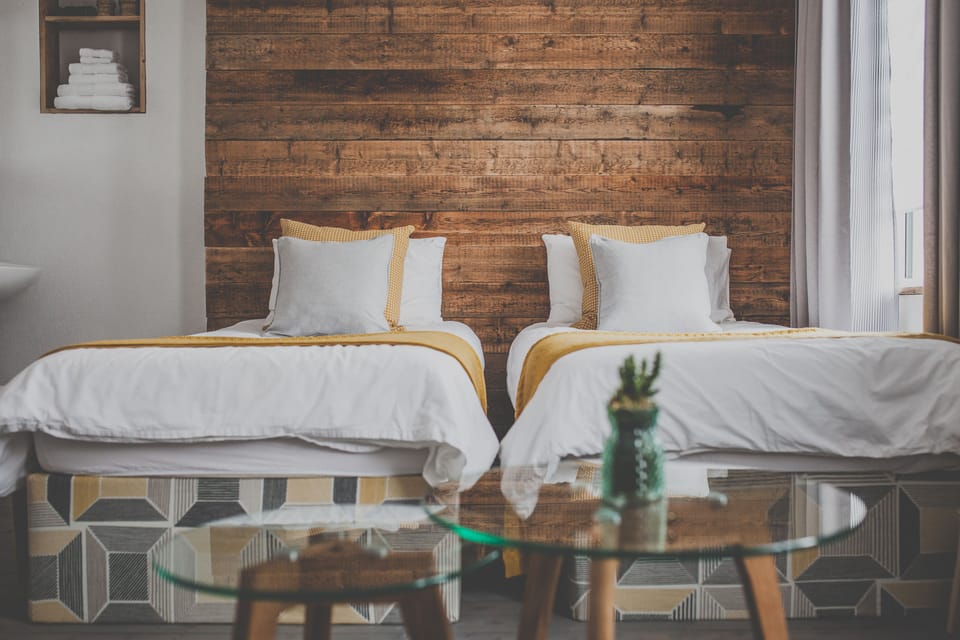 Standard Triple Room, 2 Twin Beds, Shared Bathroom | Individually decorated, individually furnished, blackout drapes