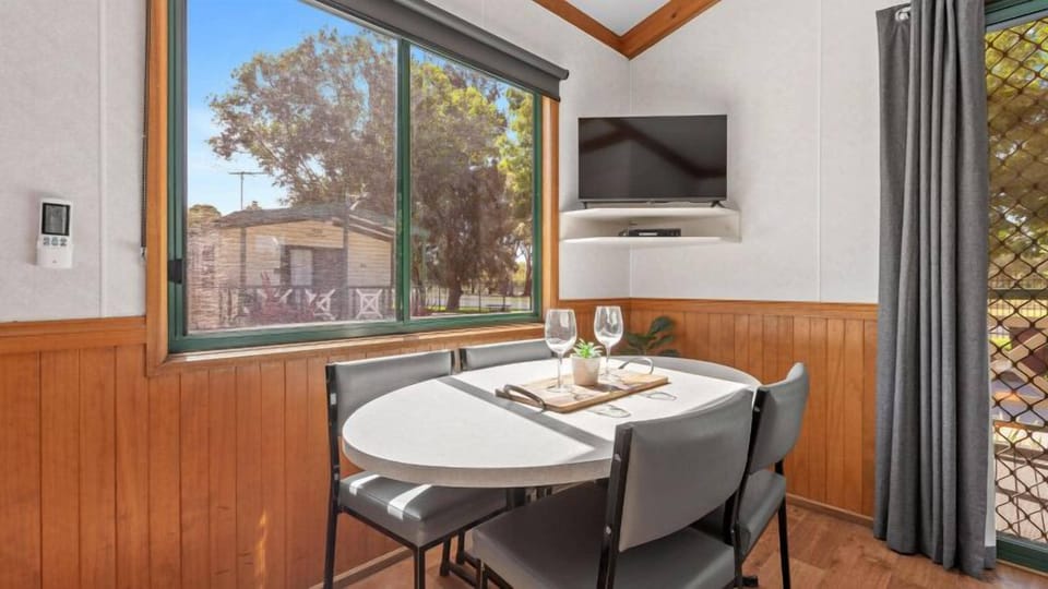 Standard Two Bedroom Family Cabin, sleeps 5 | Living area | Flat-screen TV, DVD player