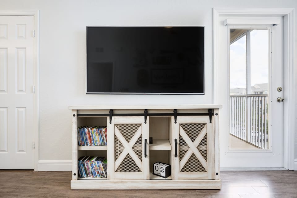 65 inch 4K TV, Blu Ray Player and over 40 DVDs and BDs of family friendly movies
