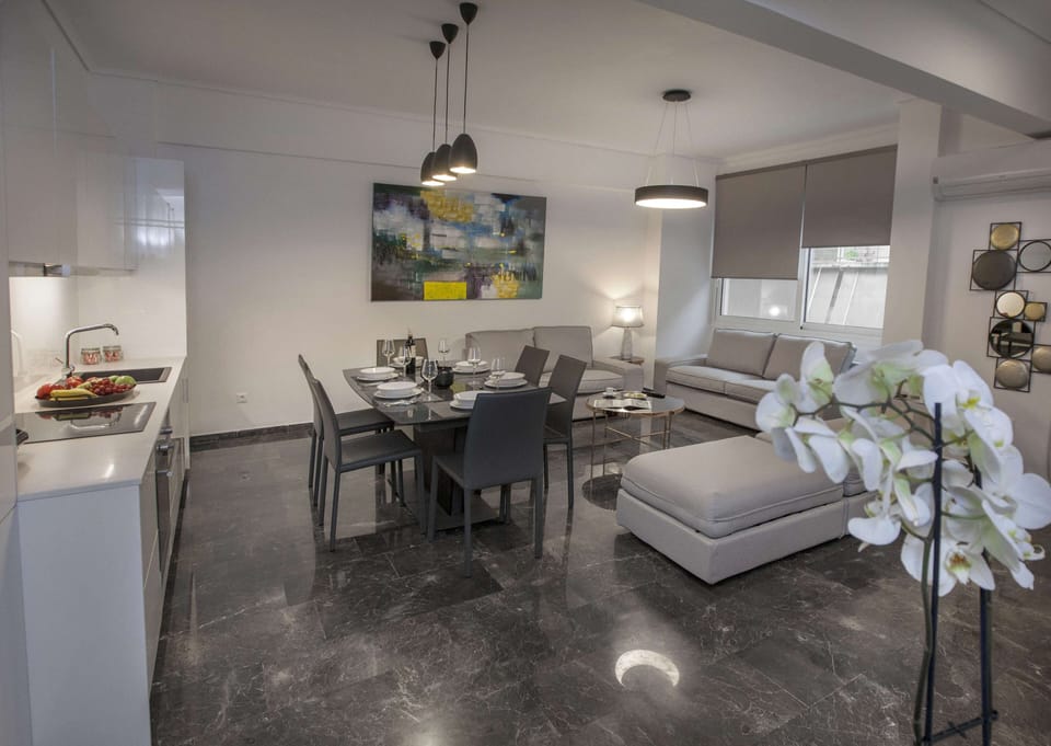 Family Apartment, 4 Bedrooms, Balcony | Living area | TV