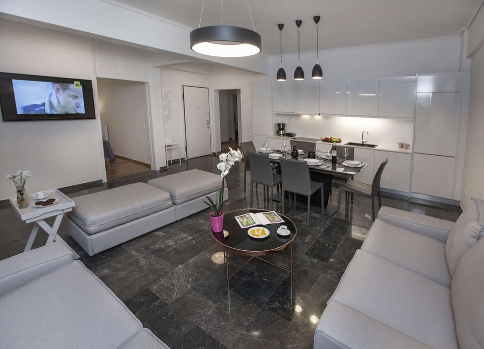 Family Apartment, 4 Bedrooms, Balcony | Living area | TV