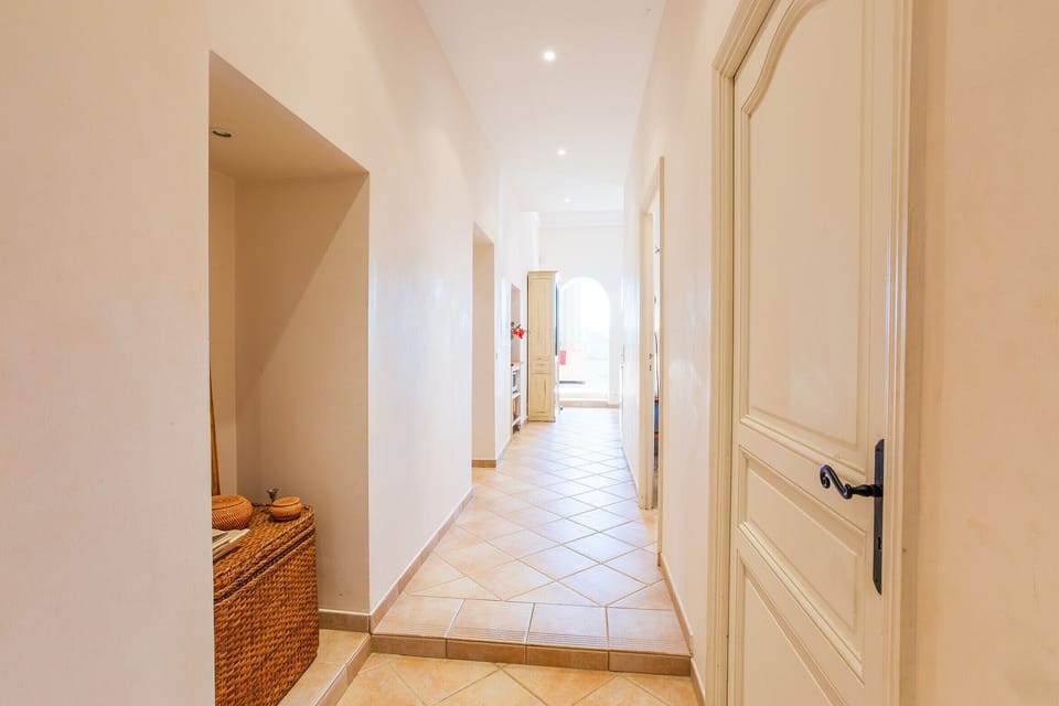 The hallway leading to the living room and kitchen