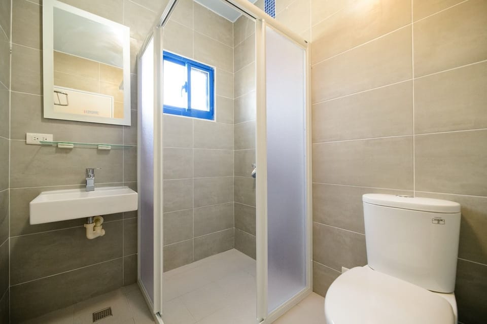 Shower, free toiletries, hair dryer, slippers