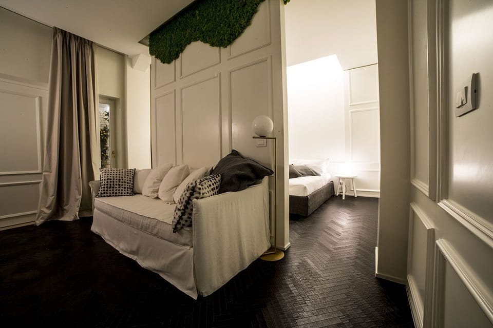 Design Suite, 1 King Bed with Sofa bed, Private Bathroom, Courtyard View | Minibar, in-room safe, individually decorated, individually furnished