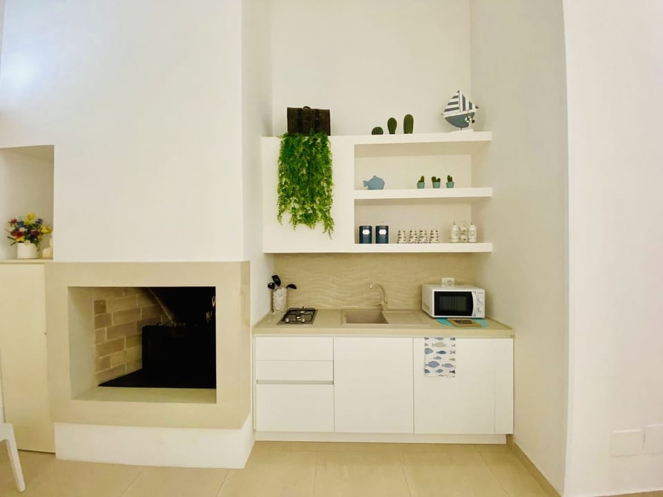 Mini-fridge, microwave, stovetop, cookware/dishes/utensils