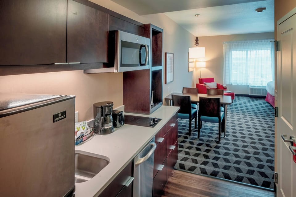 Studio, 2 Queen Beds | Private kitchen | Full-size fridge, microwave, stovetop, dishwasher