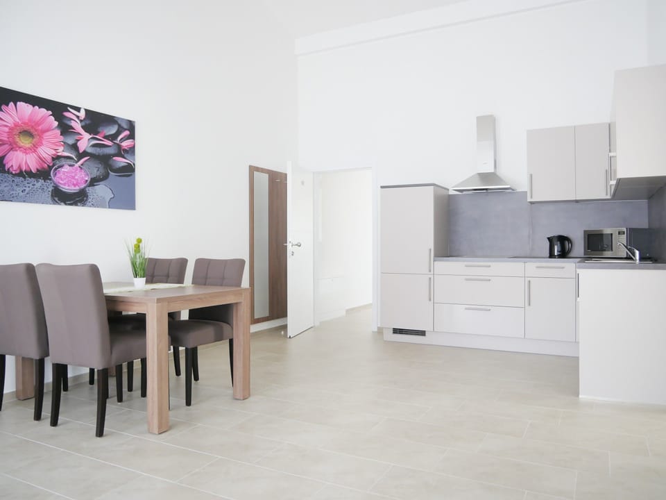 Family Apartment, 1 Bedroom, Non Smoking, Balcony | In-room dining