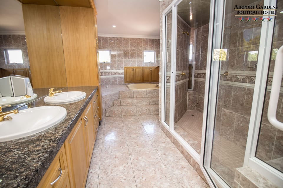 Paris Presidential Suite | Bathroom | Designer toiletries, hair dryer, towels, soap