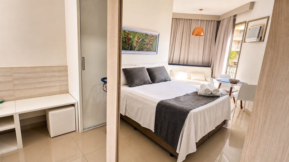 Basic Apartment | Premium bedding, desk, blackout drapes, iron/ironing board