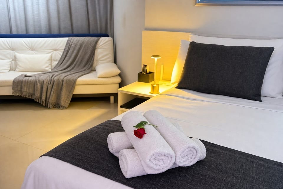 Basic Apartment | Premium bedding, desk, blackout drapes, iron/ironing board