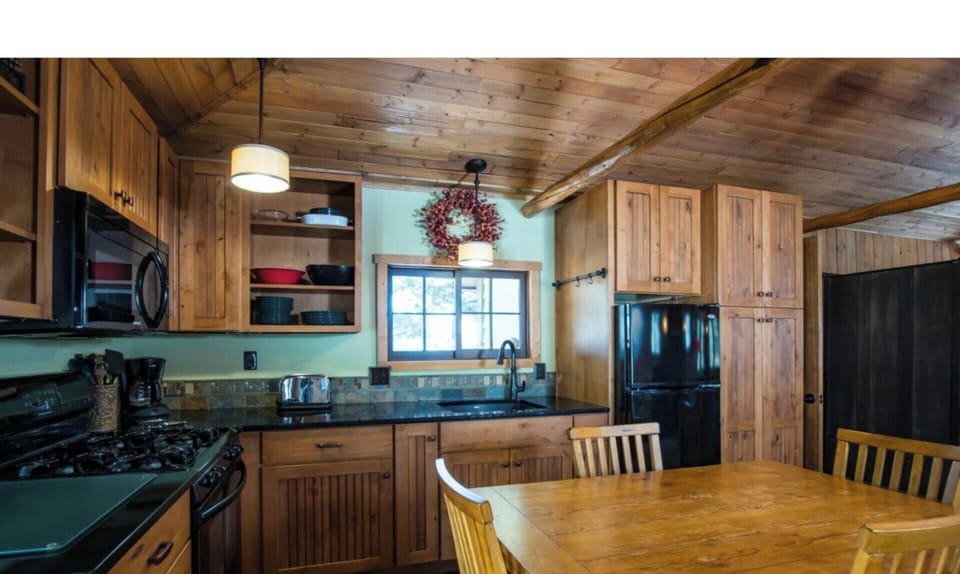 Updated kitchen with gas range.  The kitchen is well stocked.