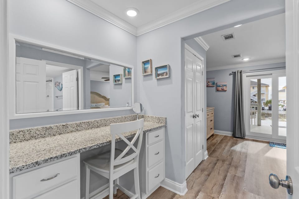 You'll love getting ready at your stylish granite vanity with ample storage and natural light streaming through the sliding doors.