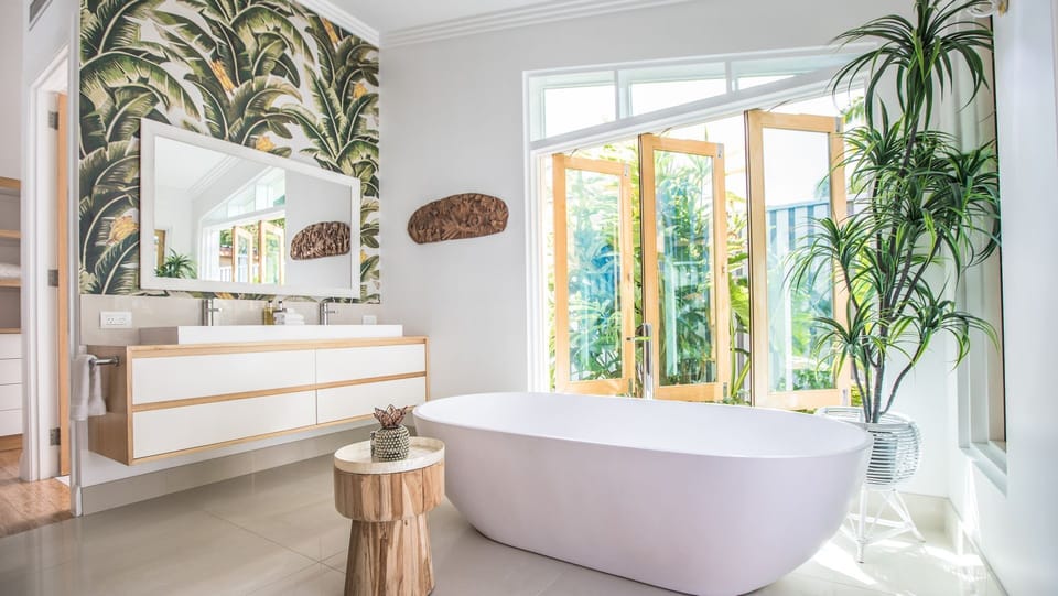 Master ensuite features a double shower, a double vanity and a stone bath.