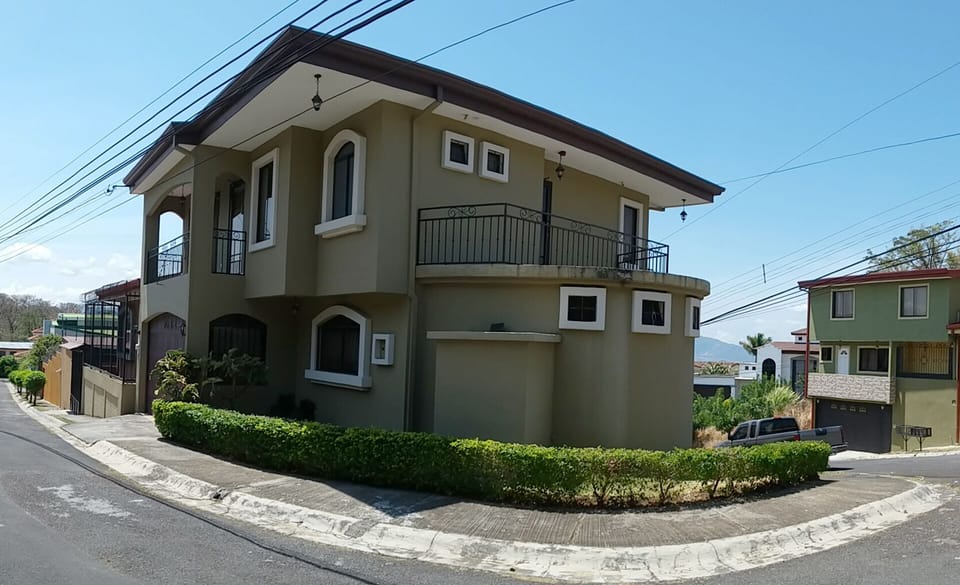 Corner lot for privacy and balconies on each side of the house.