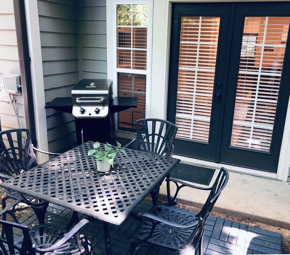 Gas grill and seating for 4 on the back patio