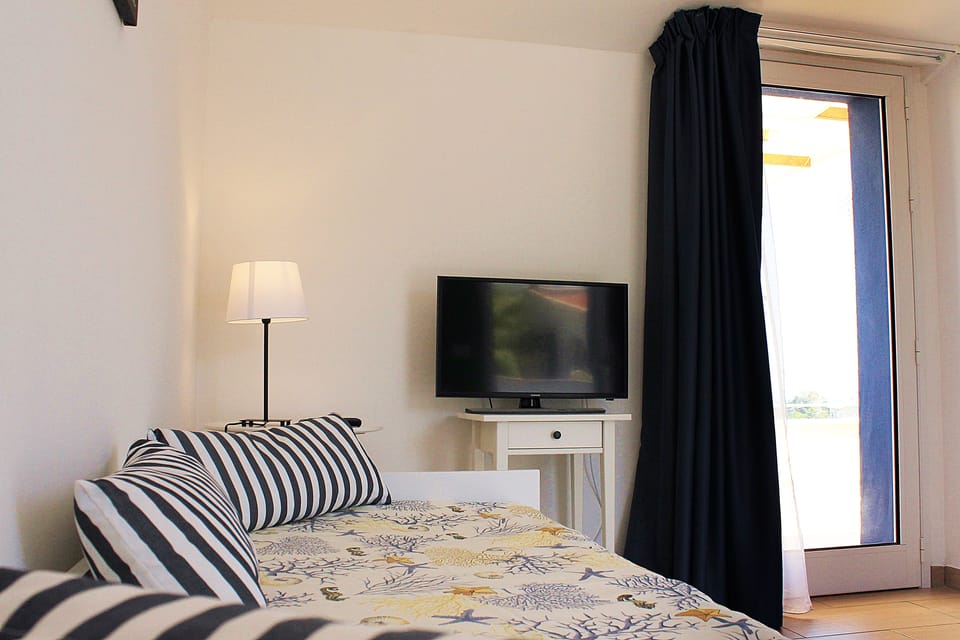 Suite, Terrace, Sea View | Down comforters, minibar, desk, blackout drapes