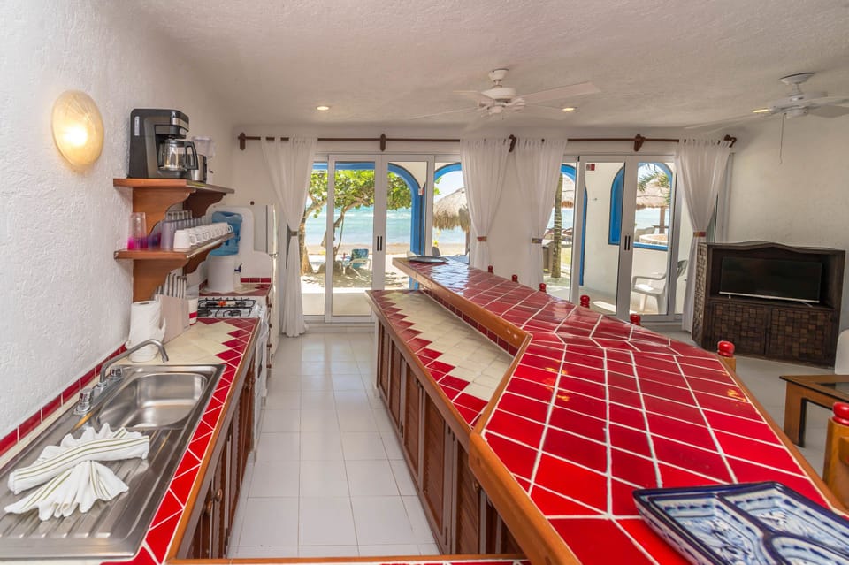 Deluxe Condo, 3 Bedrooms, Beachfront | Private kitchen | Mini-fridge, coffee/tea maker