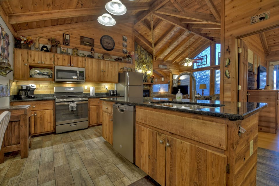 Upgraded kitchen...lighting, slate appliances, granite, plank tile, etc.