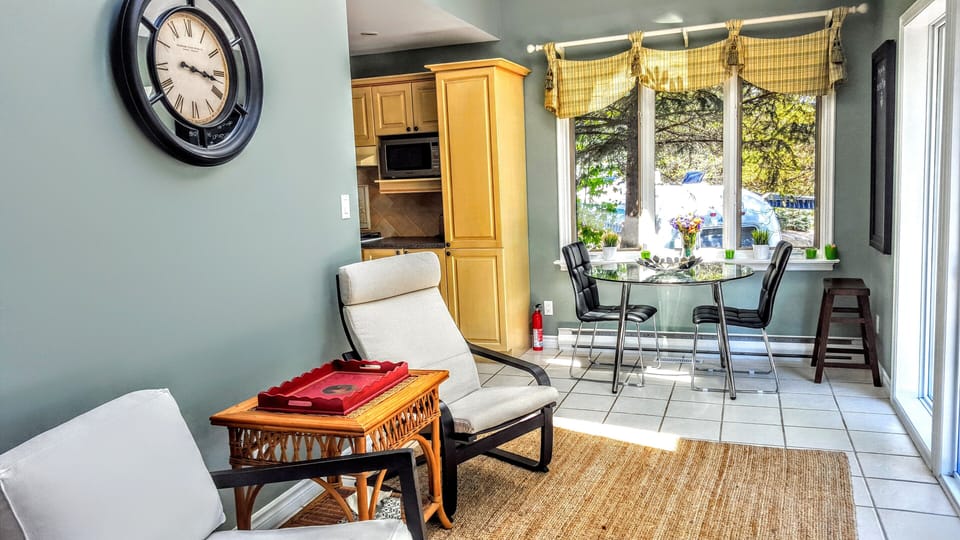 Sunroom overlooking the walkout deck and the water