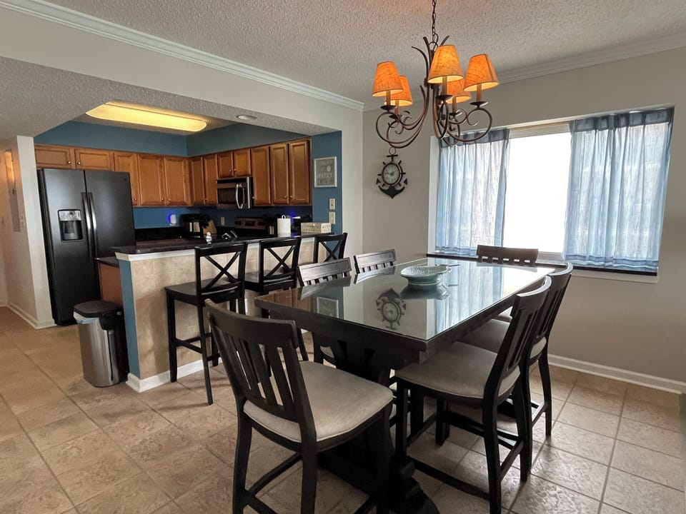 Dining room table is rectangular with 6 matching chairs.