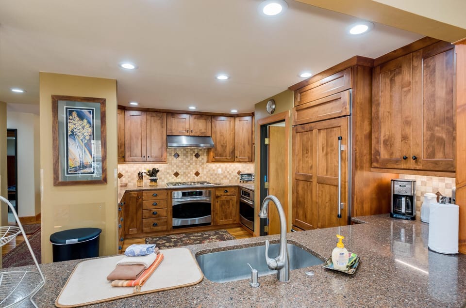Kitchen with Sub Zero. Door into Pantry.