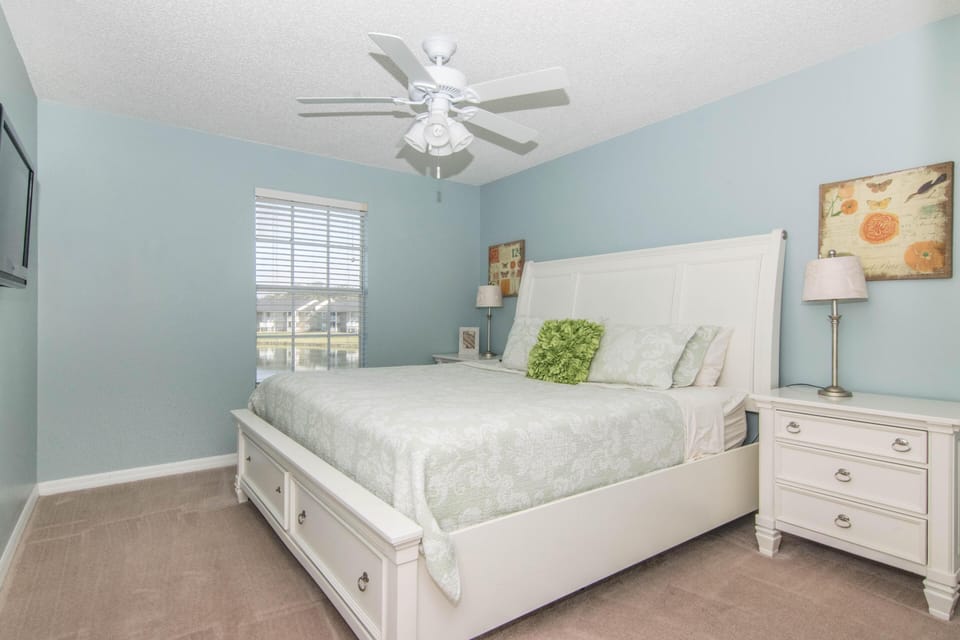 Master Bedroom with King Size Bed, TV, Walk In Closet, and Lake Views.