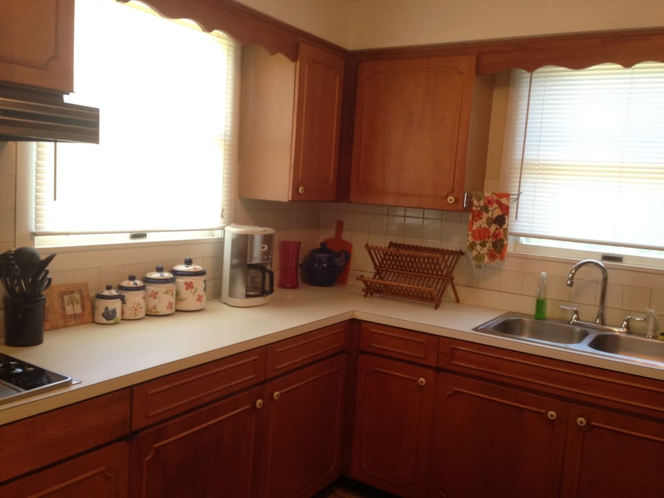 Large Sink Coffee Maker Range top next to Built in Oven