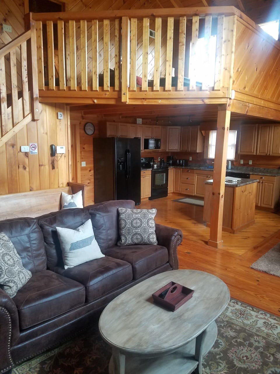 Another view of the living, dining, and kitchen areas.