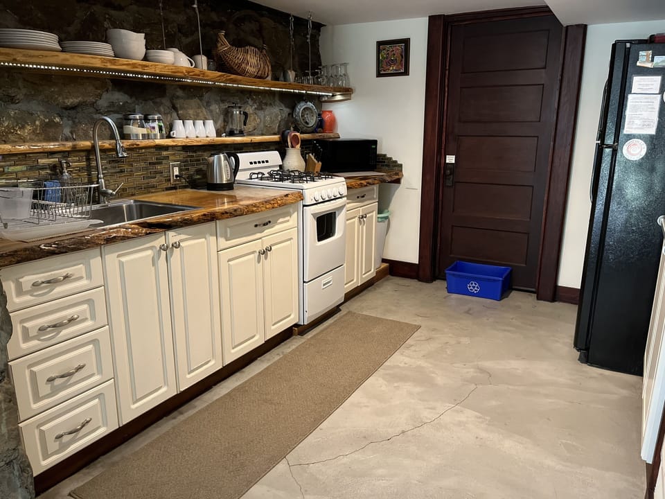 Galley Kitchen with everything you need:
Sink, Stove, Microwave, Refrigerator