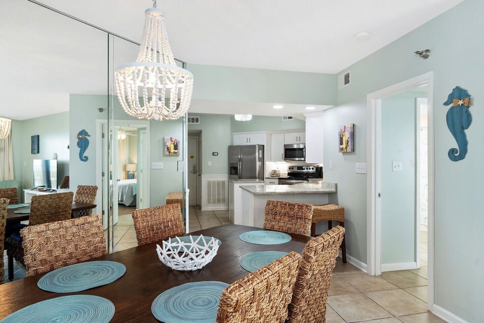 Large dining room table that seats 6 & 2 barstools that provide extra seating. 