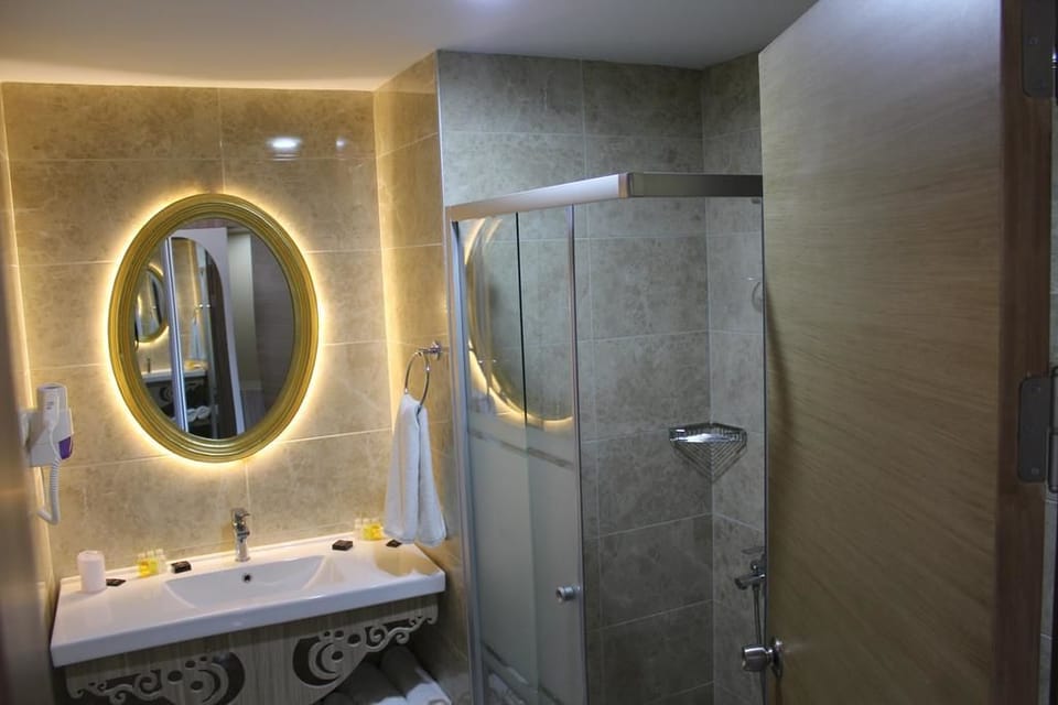 Shower, free toiletries, hair dryer, towels